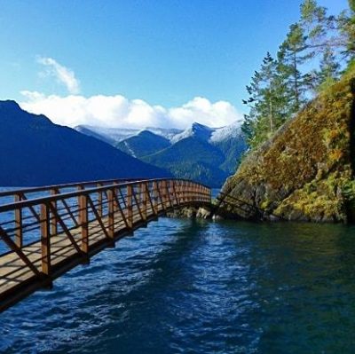 bridge over water between mountains