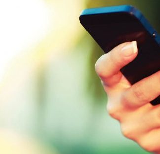 Person holding cellphone indicating free WiFi