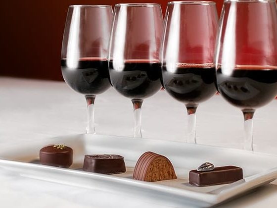 Glasses of red wine and chocolates