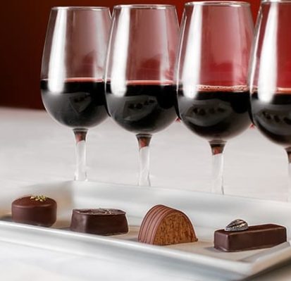 Glasses of red wine and chocolates