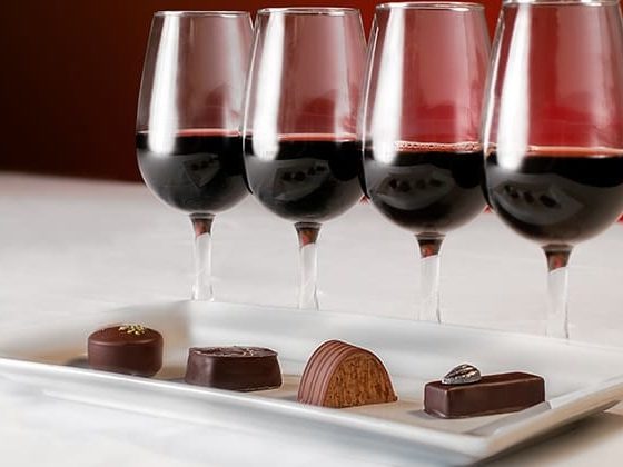 Glasses of red wine and chocolates