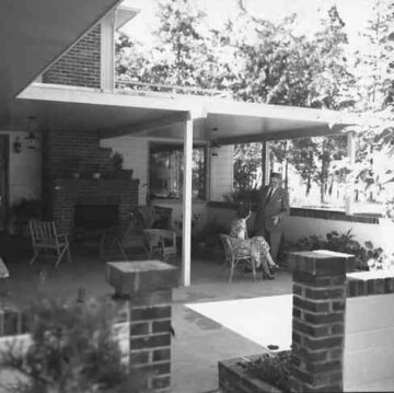 Historical view of man and lady relaxing on patio