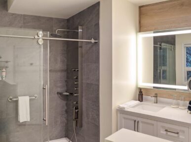 Image of bathroom with large glass shower and sink