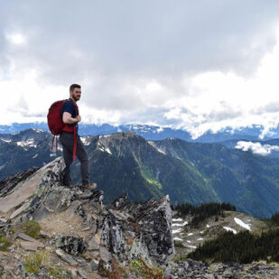 Hiker on top of a rocky peak